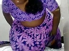 Indian chick on all sides of over purple garments romped